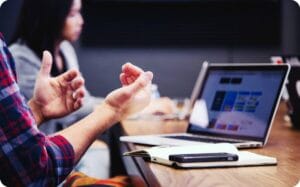 explaining to colleagues in a meeting at work