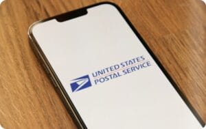 a phone with a United States Postal Service and logo on the screen