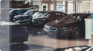 black card being parked in a dealership